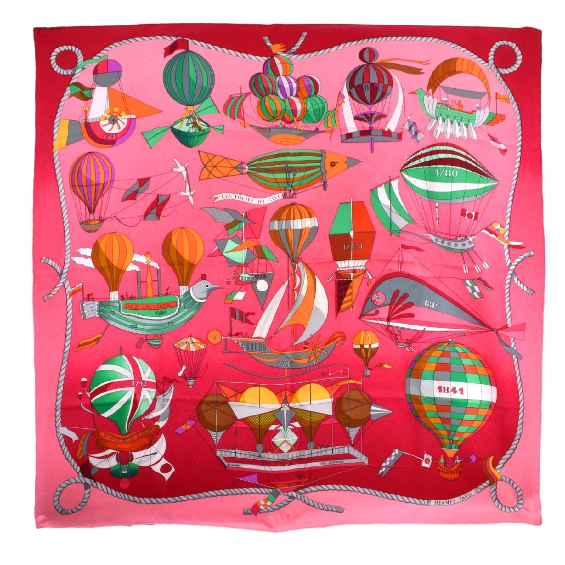 Vintage HermÃ¨s Les Folies du Ciel Silk Scarf: Vintage HermÃ¨s Les Folies du Ciel Silk Scarf by Loic Dubigeon in Original Box. Measures 35-1/4" H x 35-1/4" W. Condition: Light spotting otherwise good used condition. Domestic Shipping: $45.00 Min