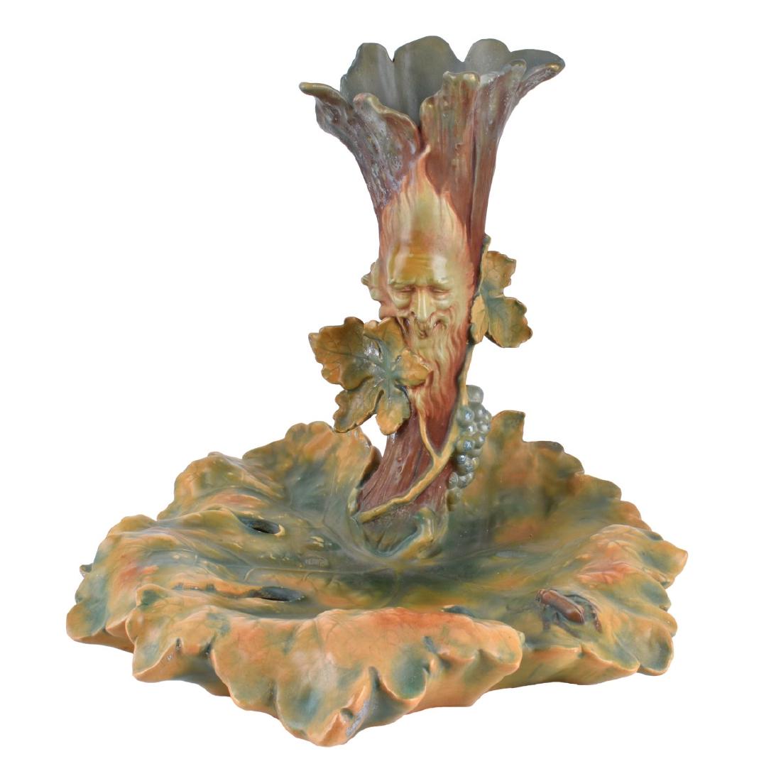 Bernard Bloch Majolica Centerpiece: Bernard Bloch Majolica Polychrome Grape Vine Form Centerpiece. Impressed "BB" mark and numbered 6227 to base. Measures 13-3/8" H x 14" W. Condition: Crazing and rubbing otherwise good condition to ver