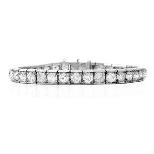 Antique 12.0ct Diamond and Platinum Bracelet: Antique Approx. 12.0 Carat TW Old European Cut Diamond nd Platinum Line Bracelet. Diamonds F-G color, VS1-VS2 clarity. Stamped Plat. Measures 6-7/8" L, 1/4" W. Approx. weight: 26.0 grams. Condition: V