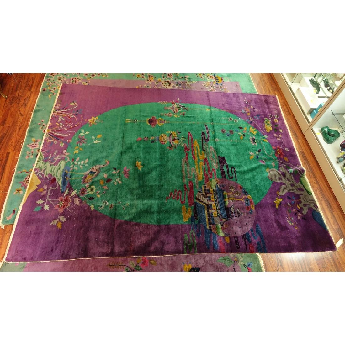 Chinese Rug: Large Chinese Art Deco Rug. Numbered 53657. Flowers, birds, palace, and bouquet motif. Measures 9' x 12'. Condition: Soiling and wear to fringes, light spotting to surface, some discoloration, needs c
