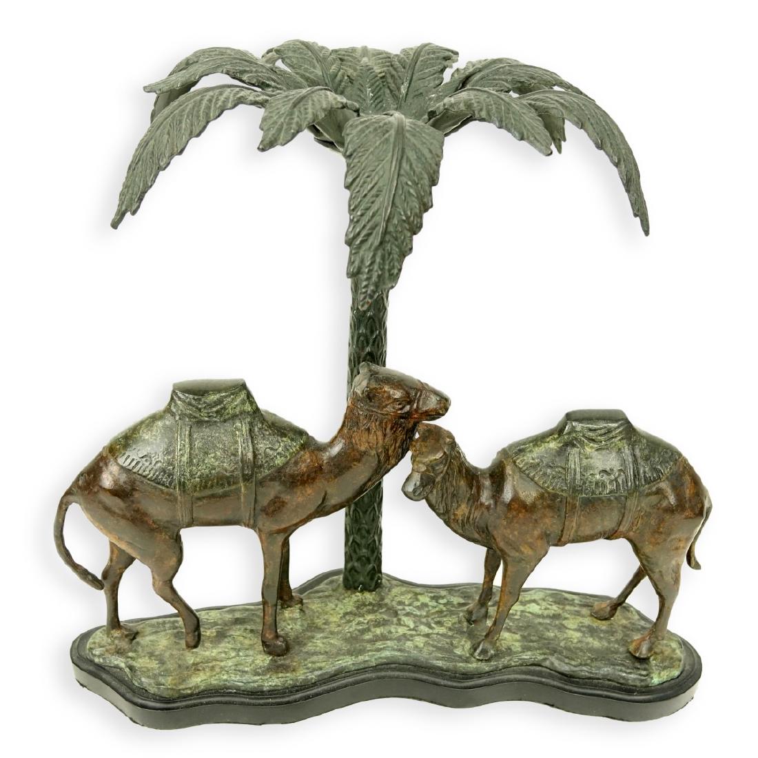 Polychrome Metal Palm Tree and Camel Sculpture: Mid Century Polychrome Metal Palm Tree and Camel Sculpture. Unsigned. Measures 14" H x 15" W. Condition: Good condition Estimate: $25.00 - $50.00 Domestic Shipping: Third party