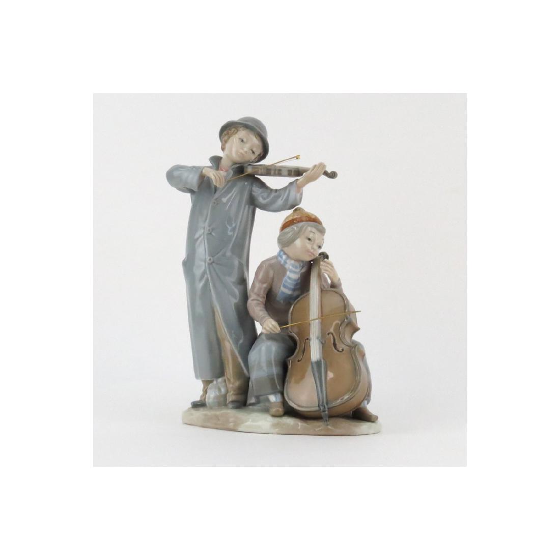 Zaphir Lladro Style Young Musicians Porcelain Grouping.: Zaphir Lladro Style Young Musicians Porcelain Grouping. Signed and artist signed Jose Puche, marked "made in Spain" on underside. Good condition. Measures 13-1/2" H x 9" W. (estimate $50-$100) Shippin