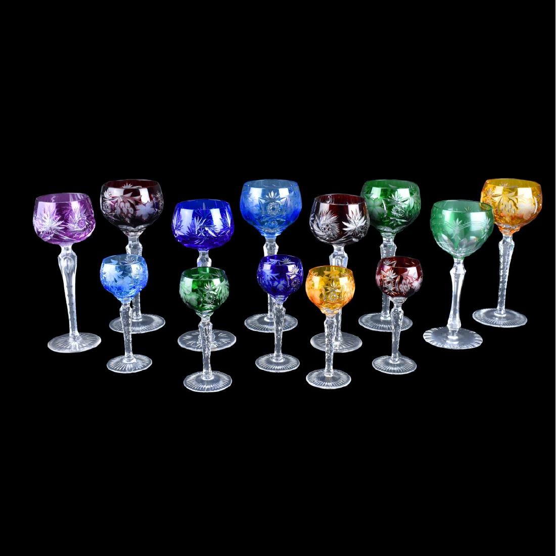 Bohemian Stemware: Thirteen (13) Bohemian Cut Glass Color Overlay Stemware. Includes: 8 tall wine glasses size ranging from 7-5/8" to 8-1/4" and (5) 5-1/2" glasses. Condition: One taller glass has a few nicks to the bas