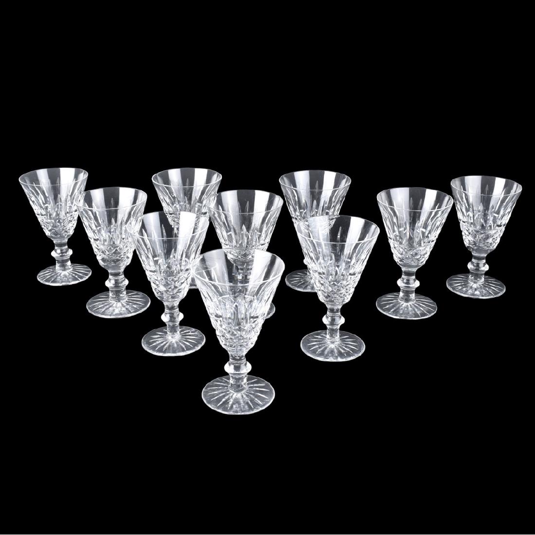 Waterford Tramore: Ten (10) Waterford Tramore Crystal Wine Glasses. Signed. Measures 5" H. Condition: Good condition. Estimate: $50.00 - $100.00 Domestic Shipping: Third party