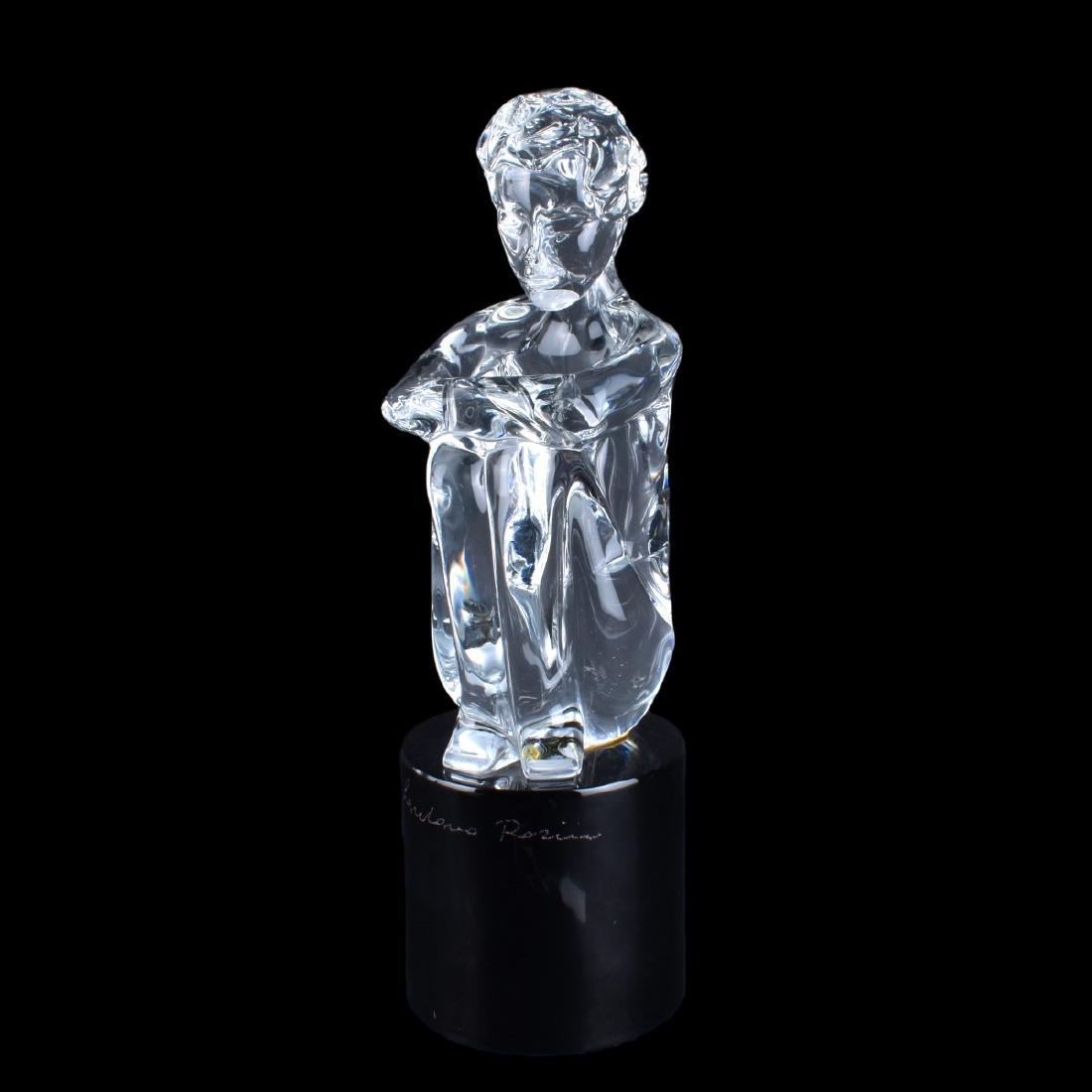 Loredano Rosin, Italian (1936â€“1991) Art Glass: Loredano Rosin, Italian (1936â€“1991) Glass sculpture "Seated Boy" Clear glass on black base. Signed. Original label. Measures 16" H. Condition: Good condition Estimate: $300.00 - $400.00 Domesti