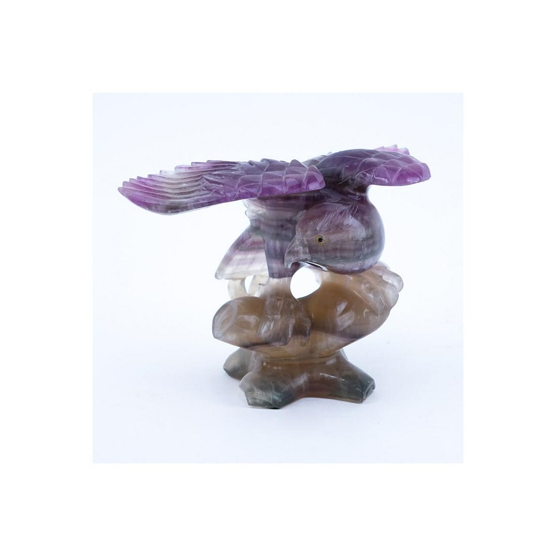 Amethyst Carved Sculpture of a Eagle Perched on Branch.: Amethyst Carved Sculpture of a Eagle Perched on Branch. A few nicks and chips otherwise good condition. Measures 7" H x 9-5/8" W. (estimate $50-$100) Shipping $62.00