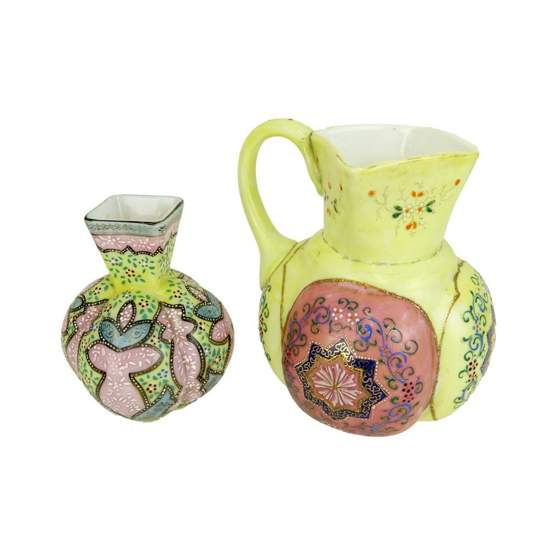 Thomas Webb Tableware: Two (2) Piece Lot of Thomas Webb Morrocan Glass Pitcher and Vase. Open pontil to base. Pitcher measures 8-7/8" H, vase measures 7" H. Condition: Rubbing to paint otherwise good condition Estimate: $50