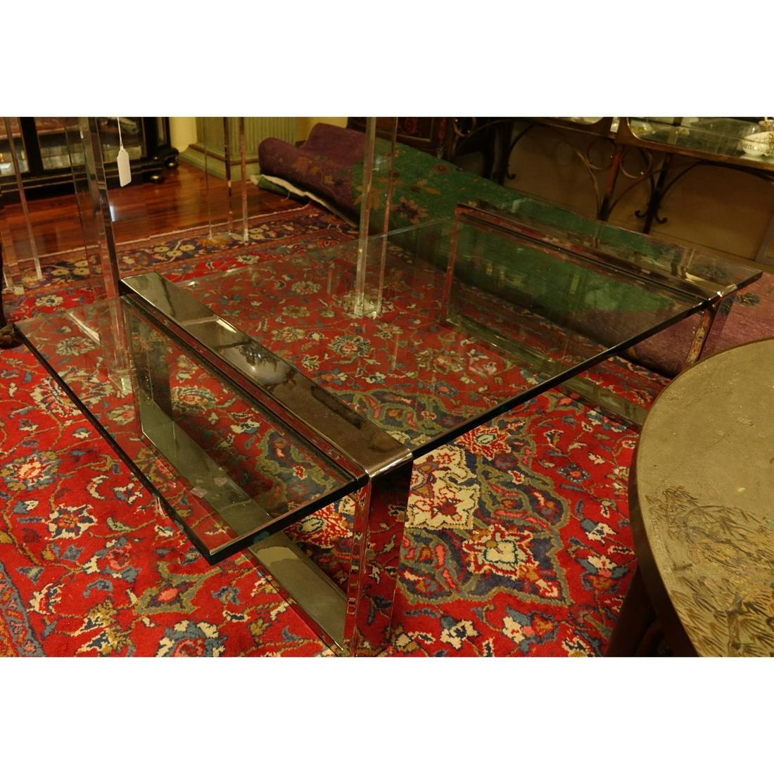 Roger Sprunger Chrome and Glass Coffee Table: Mid Century Roger Sprunger Chrome and Glass Coffee Table. Measures 15" H x 56" W x 28" D. Condition: Good condition Estimate: $300.00 - $400.00 Domestic Shipping: Third party