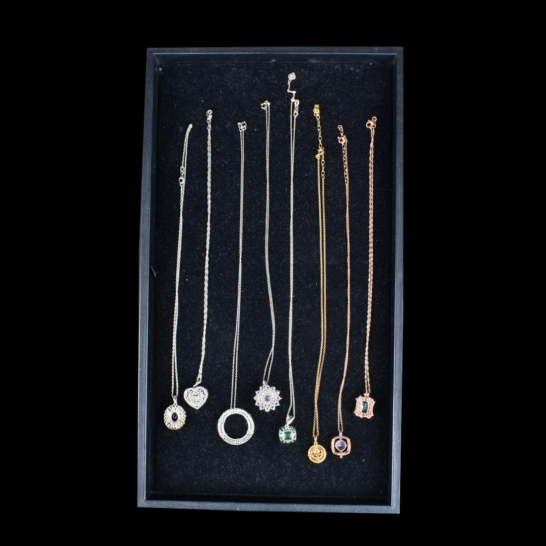 8pcs Sterling Designer Costume Jewelry Pendants: Eight (8) Sterling Designer Costume Jewelry Pendants. Marked 925. Weight 50.3g. Some FZN, Vannak, PDJ, Gold over silver. Chain and pendant Measures 10" L, most pendants measure 1" L Condition: Good to