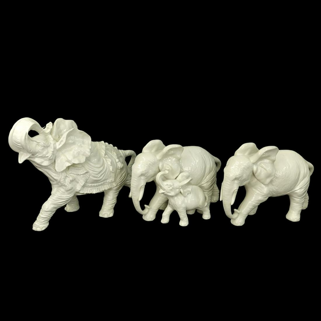 Vintage Three Italian White Pottery Elephants: Vintage Three (3) Italian White Pottery Elephants. One elephant with baby, one trumpeting, one walking. Signed with a 5 pointed crown Capo Di Monte under it and Made in Italy. Largest measures approx.