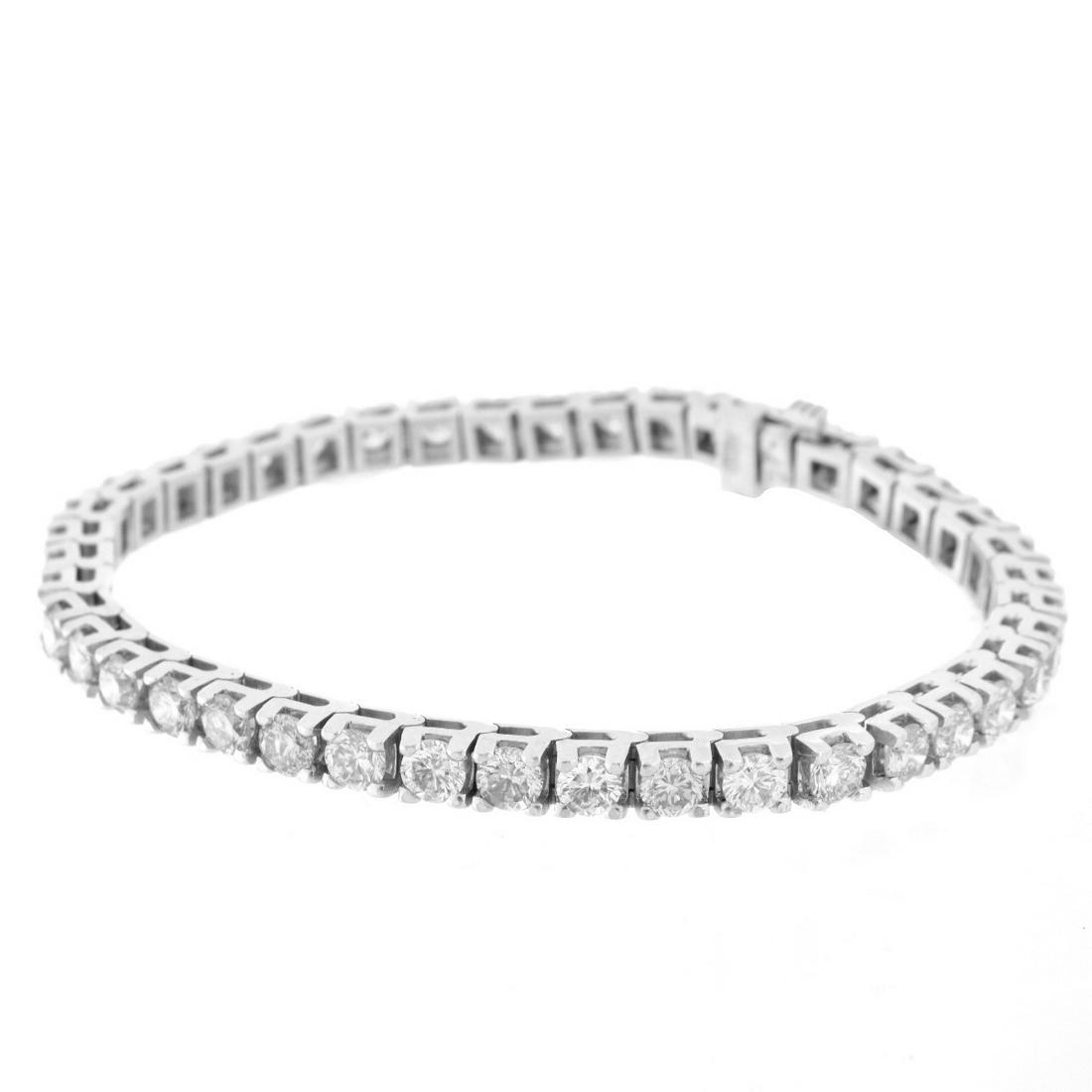 Diamond and 14K Tennis Bracelet: Vintage 8.5 Carat Round Brilliant Cut Diamond and 14 Karat White Gold Tennis Bracelet. Diamonds H-J color, VS-1 to SI-1 clarity with a few SI-2. Stamped 14K. Measures 7-1/4" L, 1/8 W. Approx. weight: 