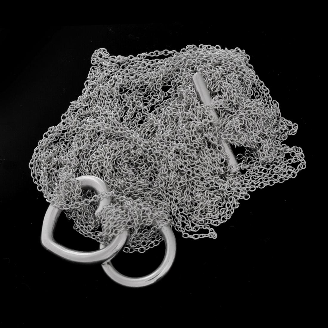 Tiffany & Co Necklace: Tiffany & Co Paloma Picasso Sterling Silver Heart Necklace with Original Bag. Signed and stamped. Approx weight: 32 grams. Condition: Needs to be untangled otherwise good condition Estimate: $100.00 -