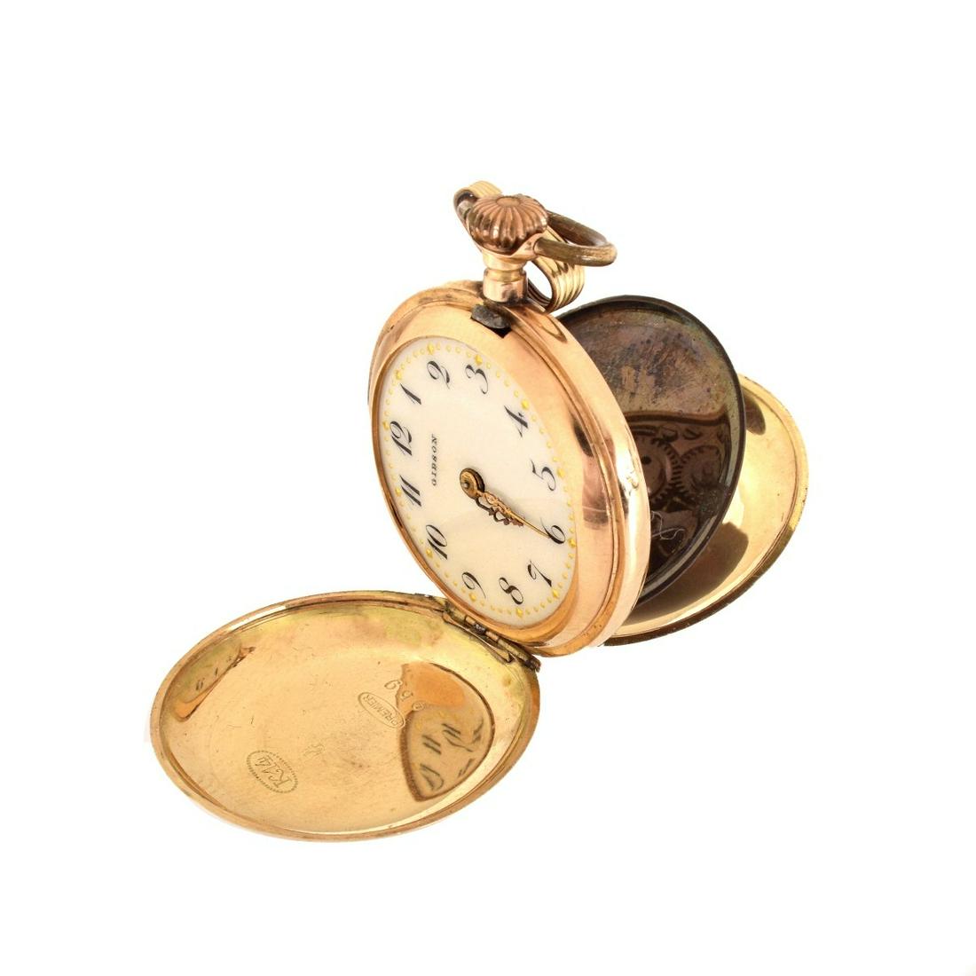 Gibson 14K Pocket Watch: Ladies Gibson 14 Karat Yellow Hunter Case Pocket Watch. Stamped 14K, numbered 116959, and marked premiere on the case. Monogrammed on outer case. Size 28mm. Approx. weight: 17.5 grams. Condition: Not 