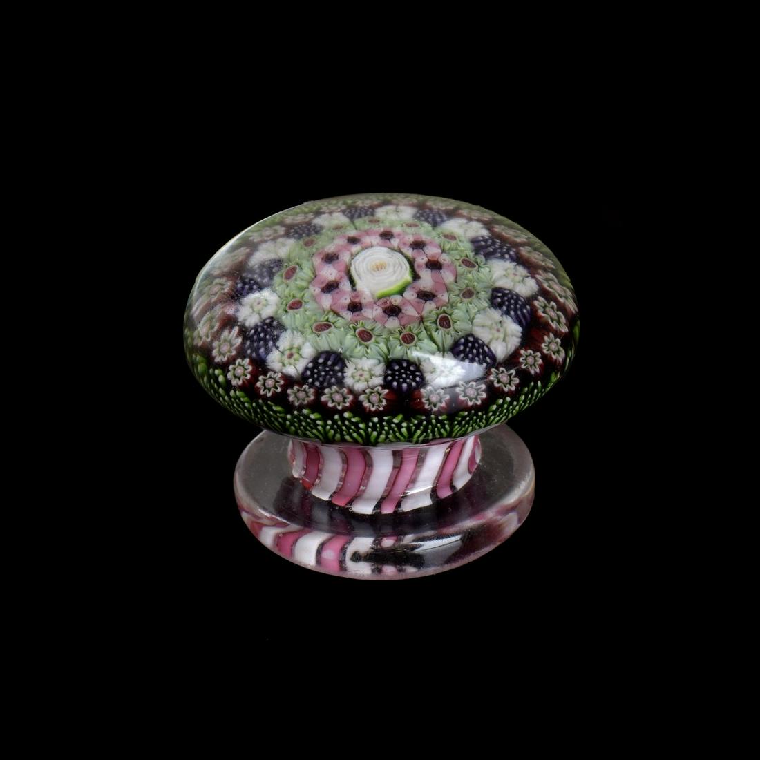 19th C. Clichy Piedouche Paperweight: 19th Century Clichy Millefiori Complex Closed Packed Piedouche Paperweight. Scattered complex millefiori canes in green, purple, white and pink encircling a central rose, pedestal base. Measures 1-1/2