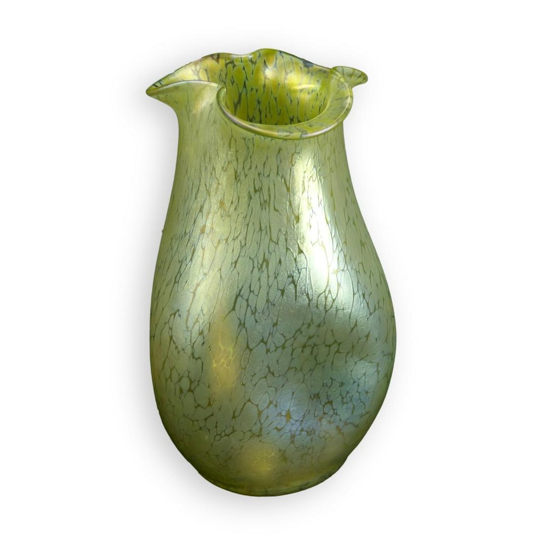 Loetz Art Nouveau Vase: Antique Loetz Art Nouveau Iridescent Gold Art Glass Vase. Polished pontil base, ruffle edge rim. Unsigned. Measures 9" H x 5-1/4" W. Condition: Good condition Estimate: $300.00 - $500.00 Domestic Ship