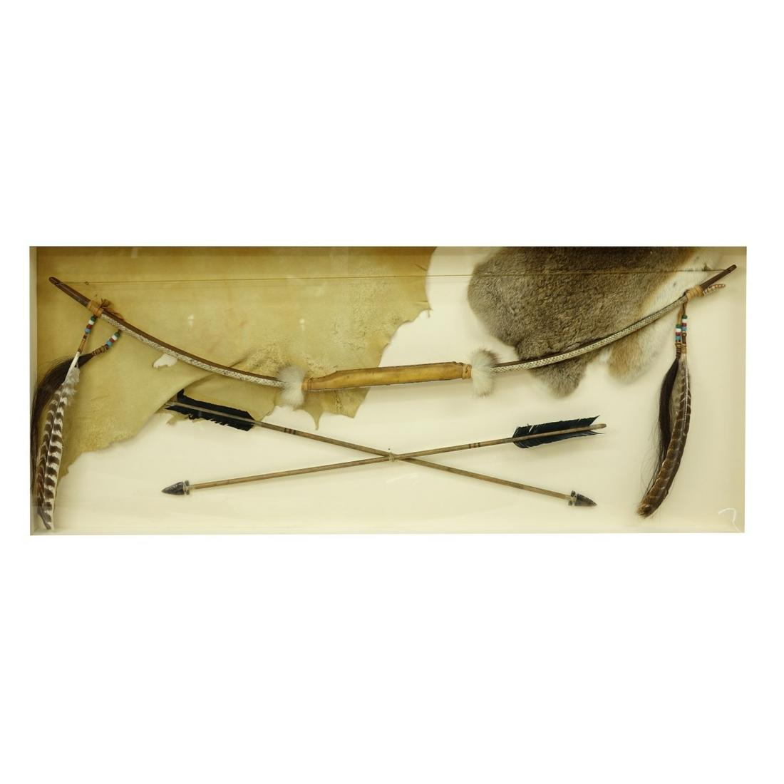 American Indian Shadowbox Bow & Arrows: American Indian Shadowbox Bow & Arrows. Specially made for the owner, possibly Sioux or Shoshone, wood bow with bead design and feathers, arrows with flights and tips, leather and rabbit accent. unsig
