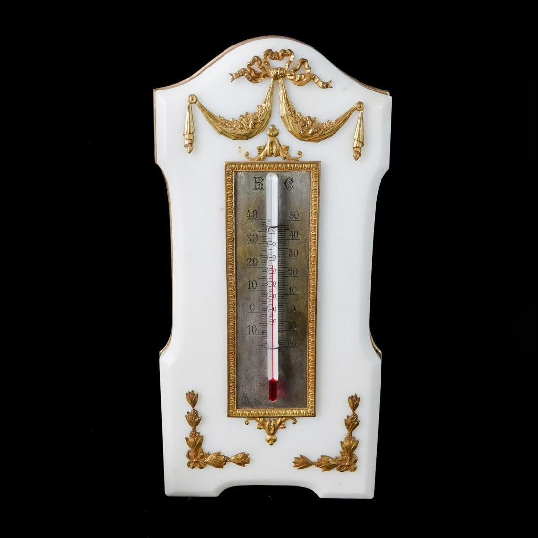 Louis XVI Style Thermometer: Antique French Louis XVI Style Marble Thermometer with Bronze Mounts. Foliage and rubbing motif. Mounted with a hook and stand. Measures 10-1/2" H x 5" W. Condition: Good condition Estimate: $100.00 -