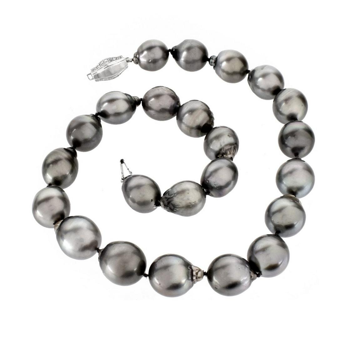Tahitian Pearl Necklace: Oversized Single Strand Twenty Three Tahitian Baroque Black Pearl Necklace with Diamond and 18 Karat White Gold Clasp. Stamped 750 to clasp. Pearls measures 15.0-17.0mm, with good polish and luster, n