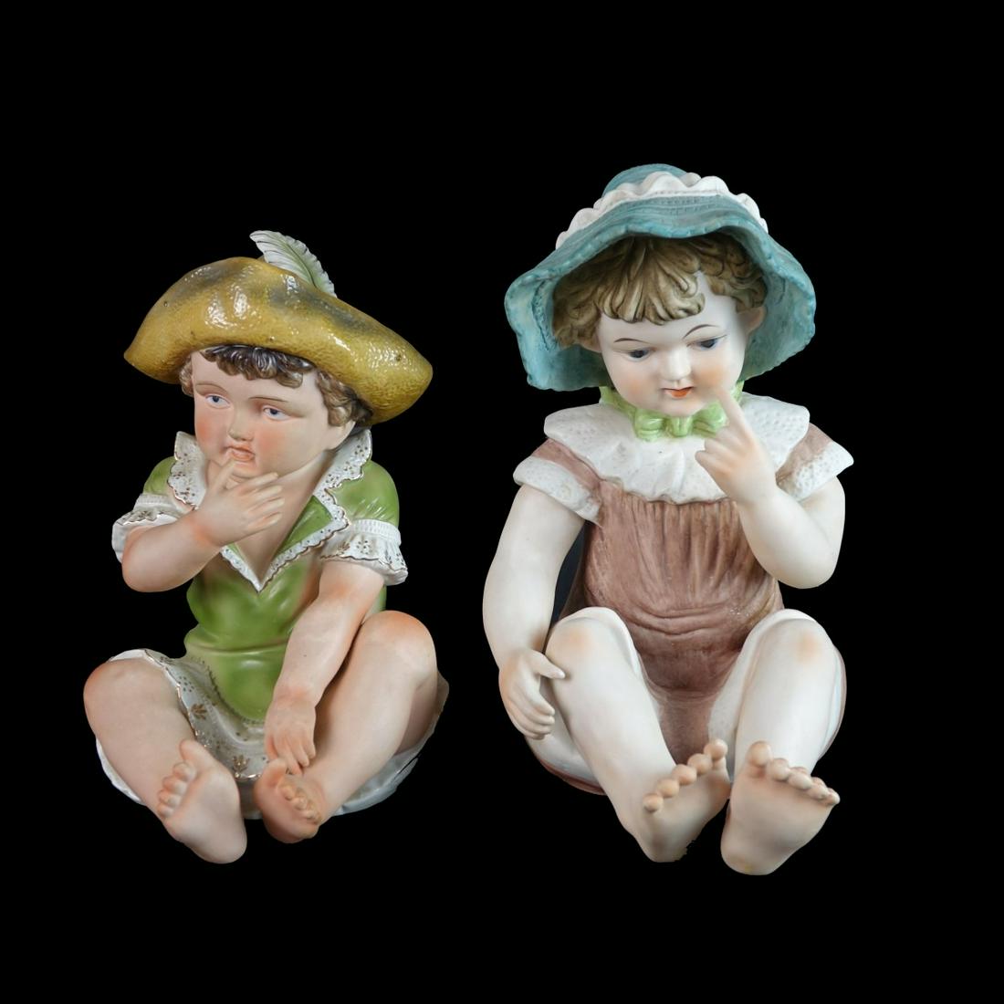 Two (2) Bisque Porcelain Seated Babies (1 of 4)