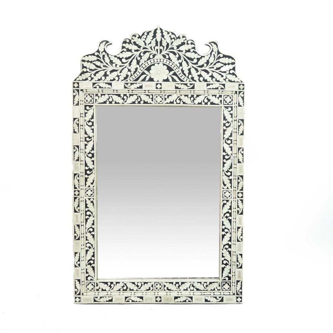 Vintage Faux Bone and Ebonized Mirror: Vintage Middle Eastern Style Faux Bone and Ebonized Mirror. Floral decoration throughout the frame. Measures 49-1/2" x 30". Condition: Good condition Estimate: $100.00 - $300.00 Domestic Shipping: Thi