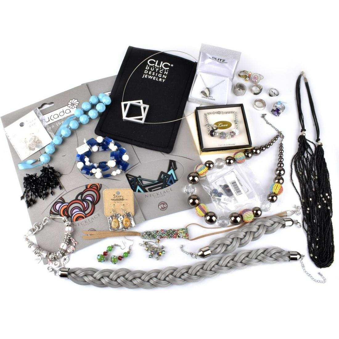 Collection of Costume Jewelry: Collection of Costume Jewelry Including Necklaces, Bracelets, Earrings and Rings. Accented with a variety of beads and faux gemstones. Many pieces are signed, some with original packaging. Condition: 