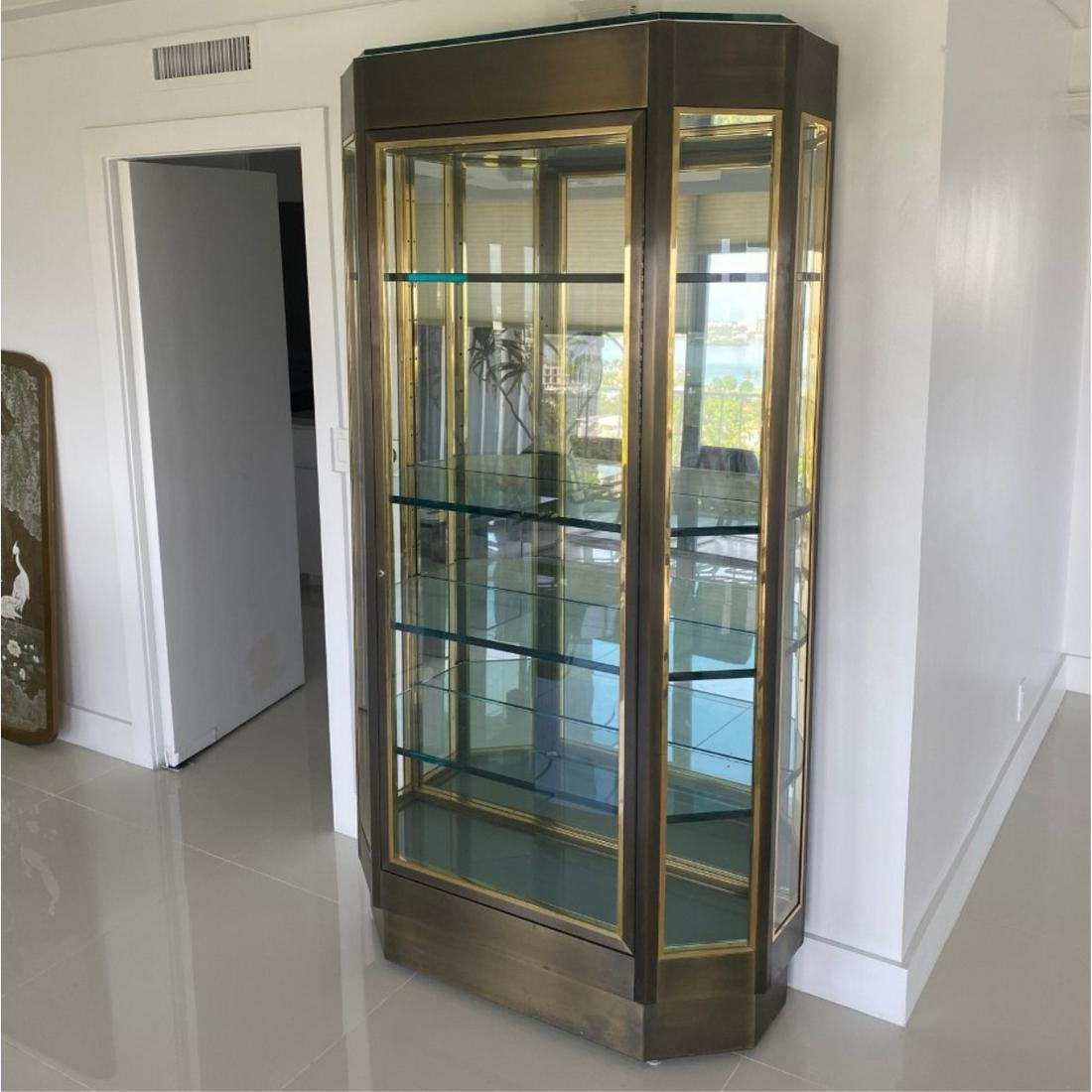 Ron Seff, American (20th Century): Ron Seff, American (20th Century) Large Size Bronze and Glass Display Case. Large center door flanked by glass panels, electrified, and having interior glass shelves. Measures 84-1/2" H x 45" W x 15-1