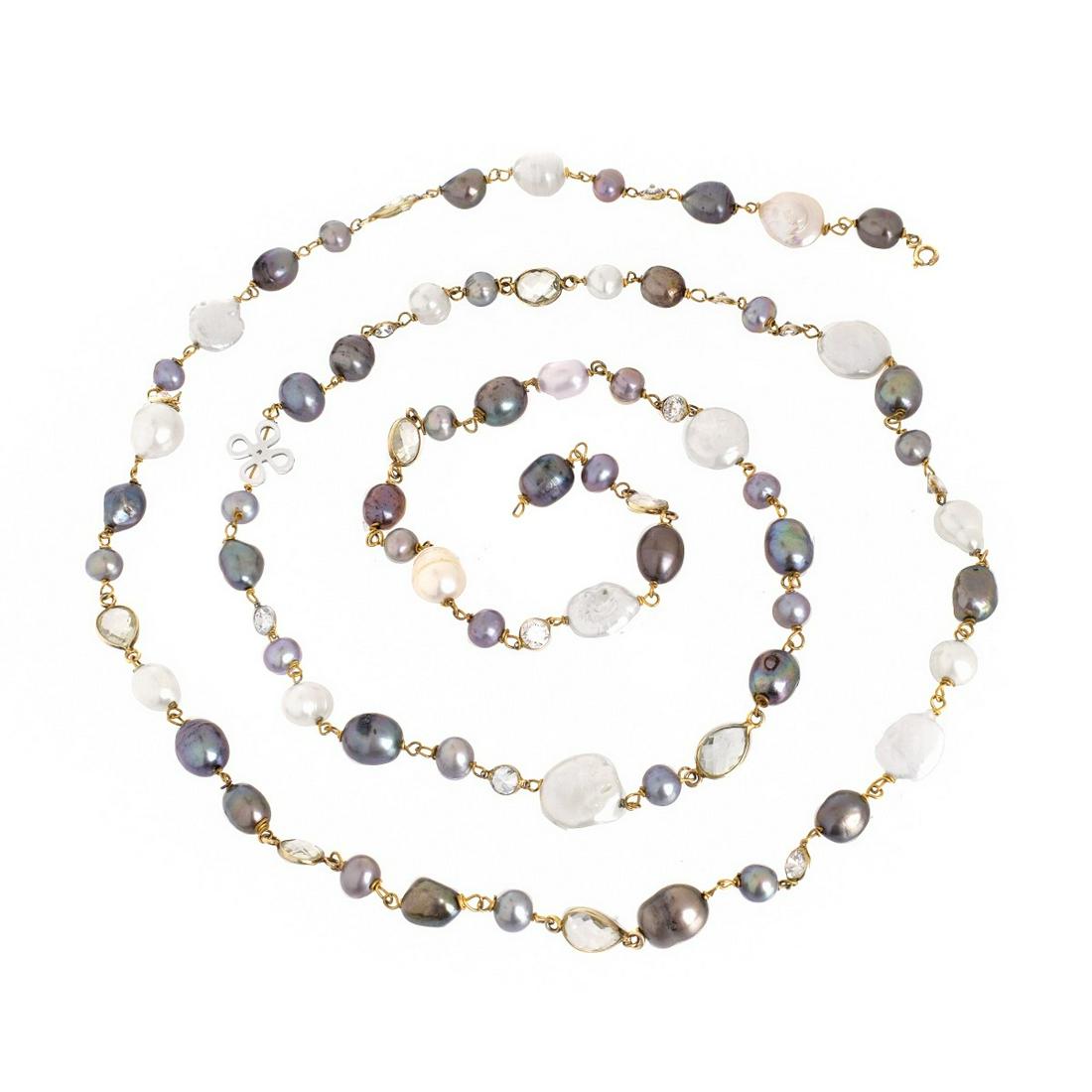 Baroque Pearl Necklace: 42.5" Long Multi Color Baroque Pearl and Gold Tone Necklace with Faux Diamond and Crystal Spacers. Pearls range from 7mm-14mm. Approx. weight: 57.77 grams. Condition: Very good condition. Estimate: $1