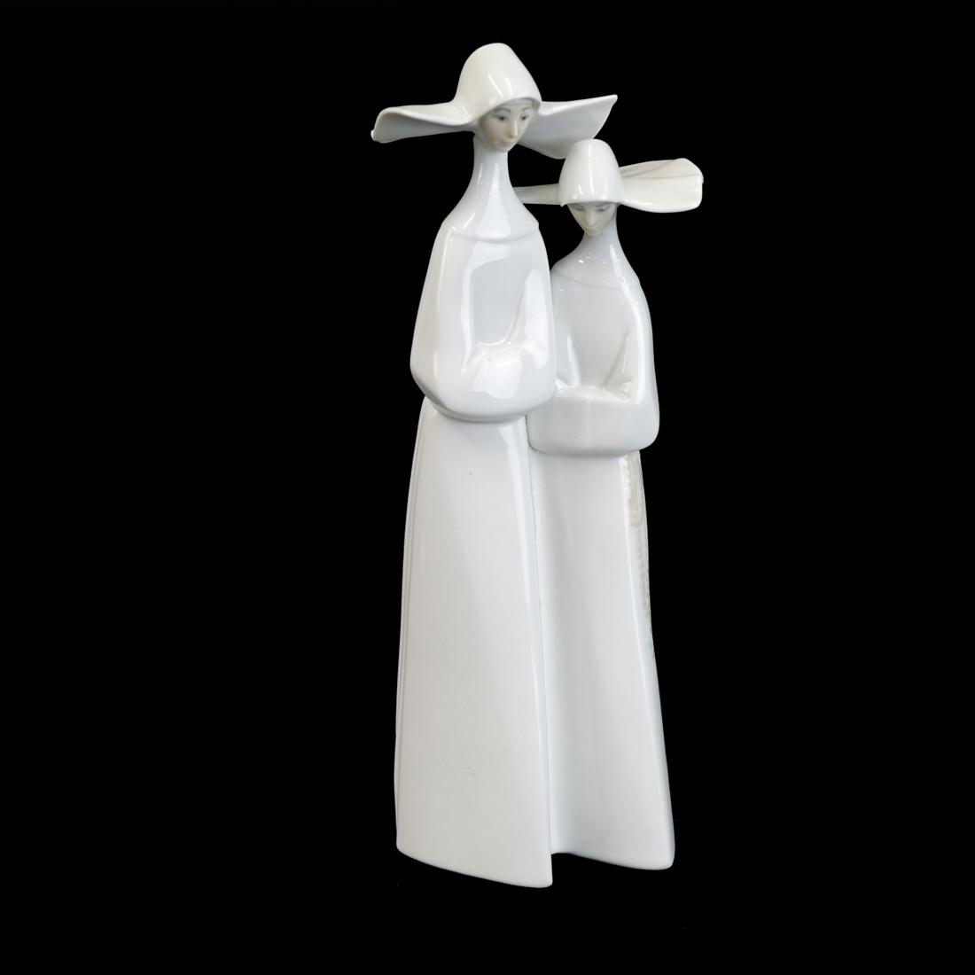 Lladro "Nuns" Glazed Porcelain Figurine: Lladro "Nuns" Glazed Porcelain Figurine. Signed. Measures 13" H x 4-3/4" W. Condition: Good condition Estimate: $50.00 - $150.00 Domestic Shipping: $72.00