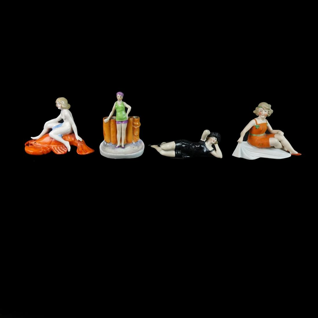 (4) Vintage Continental Porcelain Bathing Beauties: Grouping of Four (4) Vintage Continental Porcelain Bathing Beauties. Includes a nude figure with lobster base, a reclining figure, a flower frog, and a seated figure. Nude figure is marked Germany and