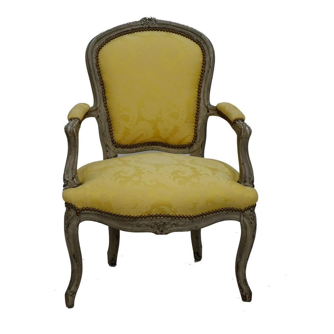 Louis XV style chair: 19th Century Carved and Painted Louis XV style Arm Chair. Measures 36" H, 24" W. Provenance: The estate of Leon Amar, Palm Beach, Florida. Condition: "As Is" antique condition. Old repairs to frame. R