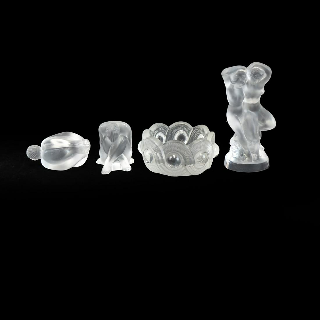 Lalique Glassware: Vintage Lalique Glassware to Include an Ashtray and Three Nude Figures. Each signed. Standing nude group measures 5-1/2" H- 2-3/8" W. Ashtray measures 1-7/8" H, 4" diam. Condition: Good pre-owned cond