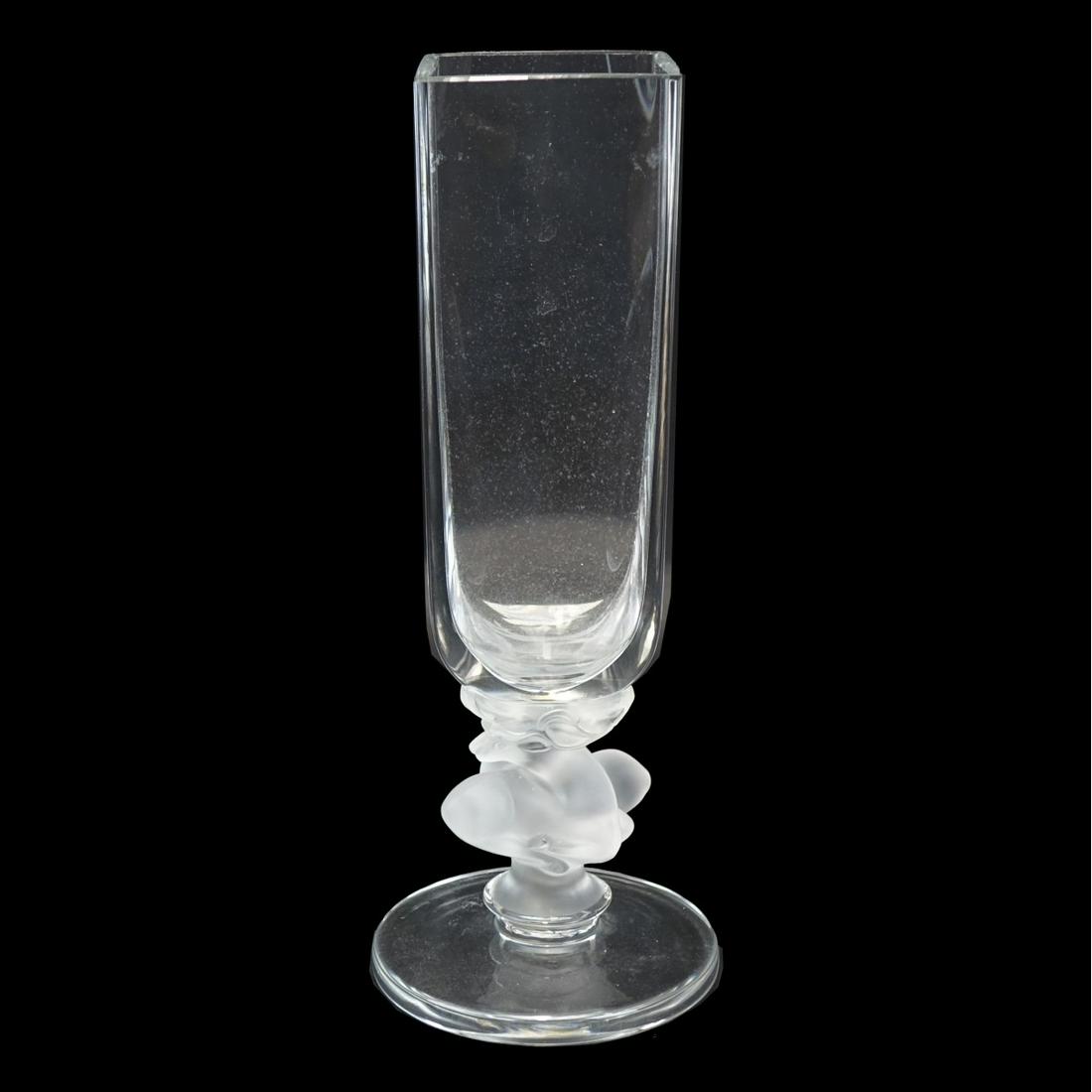 Lalique Vase with Reclining Deer Motif: Lalique Frosted and Clear Vase with Reclining Deer Motif. Signed Lalique France on the bottom side. Measures 11-1/4". Condition: Good condition. Estimate: $200.00 - $500.00 Domestic Shipping: $72.00