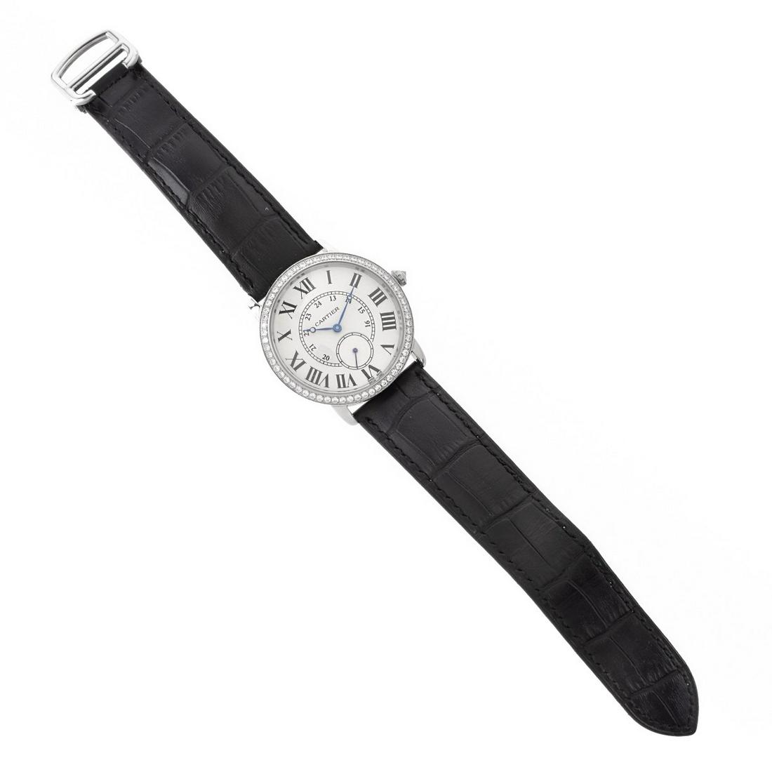 Cartier Replica Watch: Cartier Replica Unisex Stainless Steel Watch with Cubic Zirconia Accented Bezel, White Dial, Roman Numerals, Leather Strap. Quartz movement. Case measures 36mm. Adjustable length strap. Condition: "As