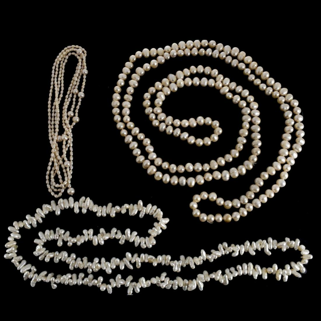 Three Baroque Pearl Necklaces: Three Vintage Single Strand Pinkish Baroque Pearl Necklaces. Longest measures 62" L; pearls measure approx. 9.5 mm. Good luster. Approx. total weight: 214.5 grams. Condition: Very good condition. Esti