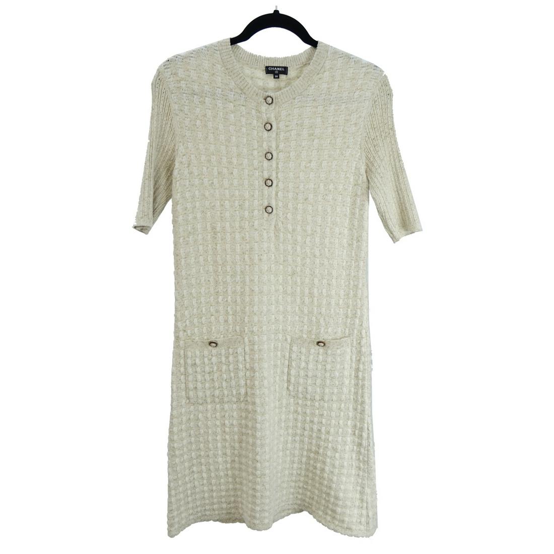 Chanel Short Sleeve Dress with Pockets: Chanel Short Sleeve Knit Dress with Pockets. Serial number BC233. Eur. size: 38. Composition: 66% nylon, 22% polyester, 6% nylon, 4% mohair, and 2% wool. Gold threading and lion head buttons embellish