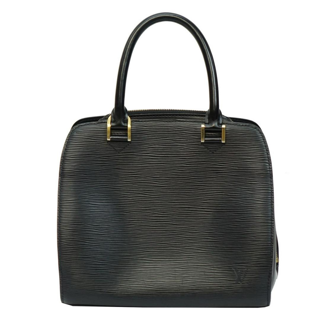 Louis Vuitton Pont Neuf Handbag: Louis Vuitton Pont Neuf Black Epi Handbag with Gold tone hardware. Serial number MI0068. Two exterior pockets, rolled leather top handles with squared light gold tone links, wrap around zippered closu