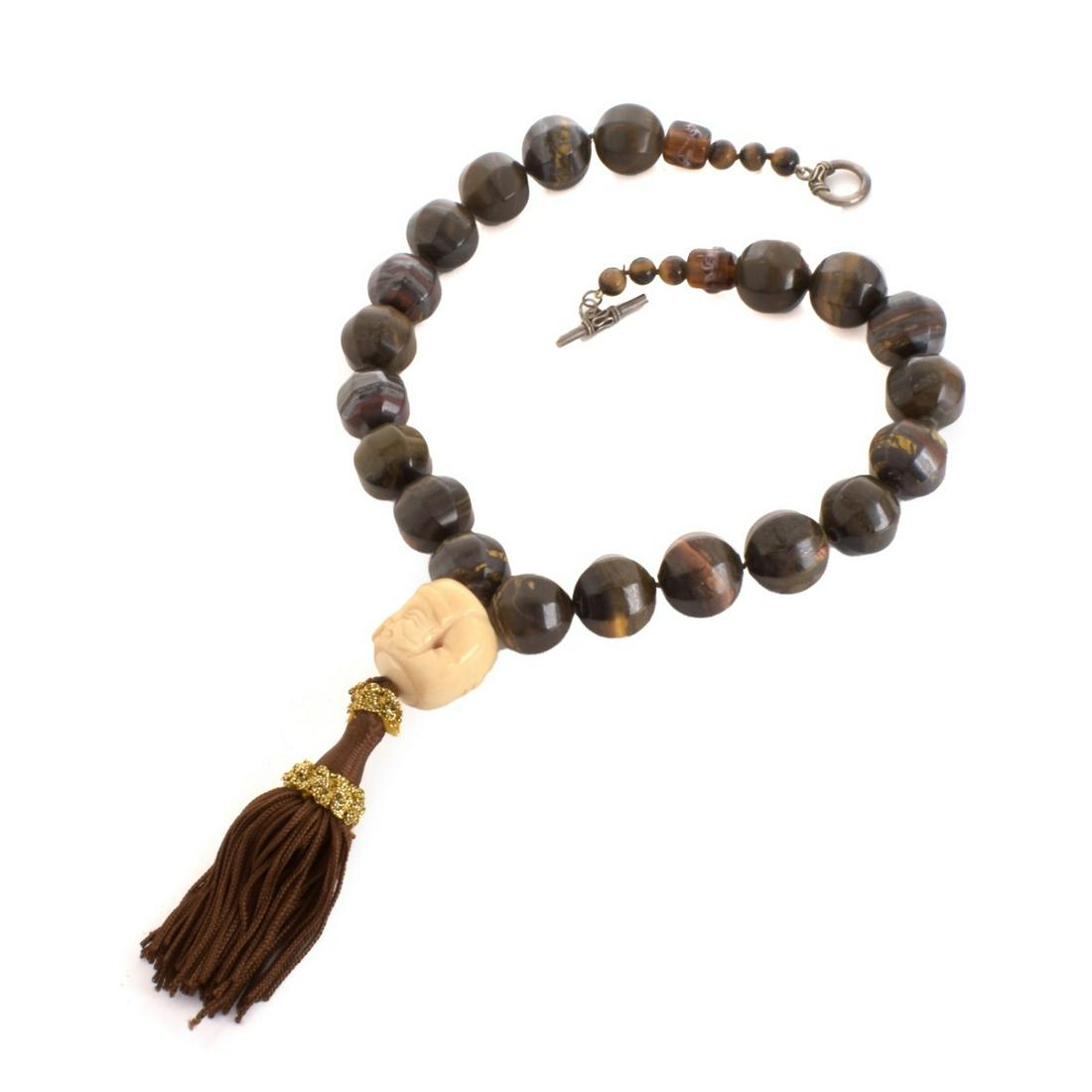Agate and Tiger Eye Tassel Necklace: Vintage Agate and Tiger Eye Bead Tassel Necklace. Large beads measure 20mm. Necklace measures 21" L, 4-1/2" drop. Approx. weight: 312.22 grams. Condition: Very good vintage condition. Estimate: $50.00