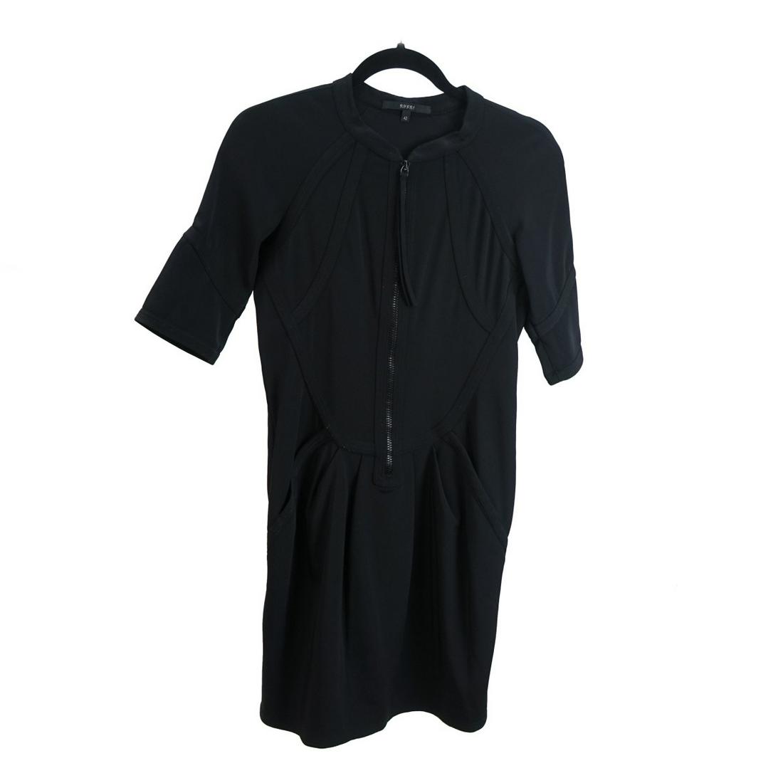 Gucci Short Sleeve Dress: Womens Gucci Short Sleeve Pleated Dress. Appropriately labeled. Zip down front, pockets. Size: 42. Composition: 65% silk, 29% polyamide, 6% elastane. 10% of the proceeds with be donated to the Never G