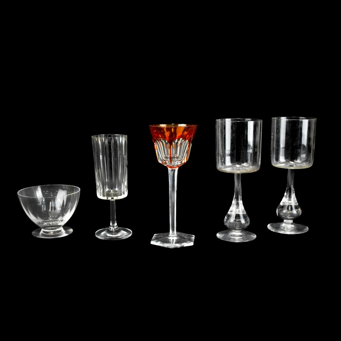 Assorted Baccarat Glasses: Grouping of Five (5) Assorted Baccarat Glasses. Includes a pair of "Jose" Water goblets measuring 7-3/4", a "Harmonie" water goblet measuring 6-3/4", a Orange Rhine Wine measuring 7-1/2", and a fruit 