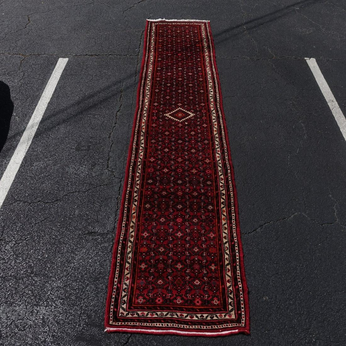 Semi Antique Persian Runner: Semi Antique Persian Runner. Multi color with busy floral decor and center medallion. Measures approx. 12' 7" x 3'. Condition: loss to fringes on one side, needs cleaning. Estimate: $100.00 - $1000.00
