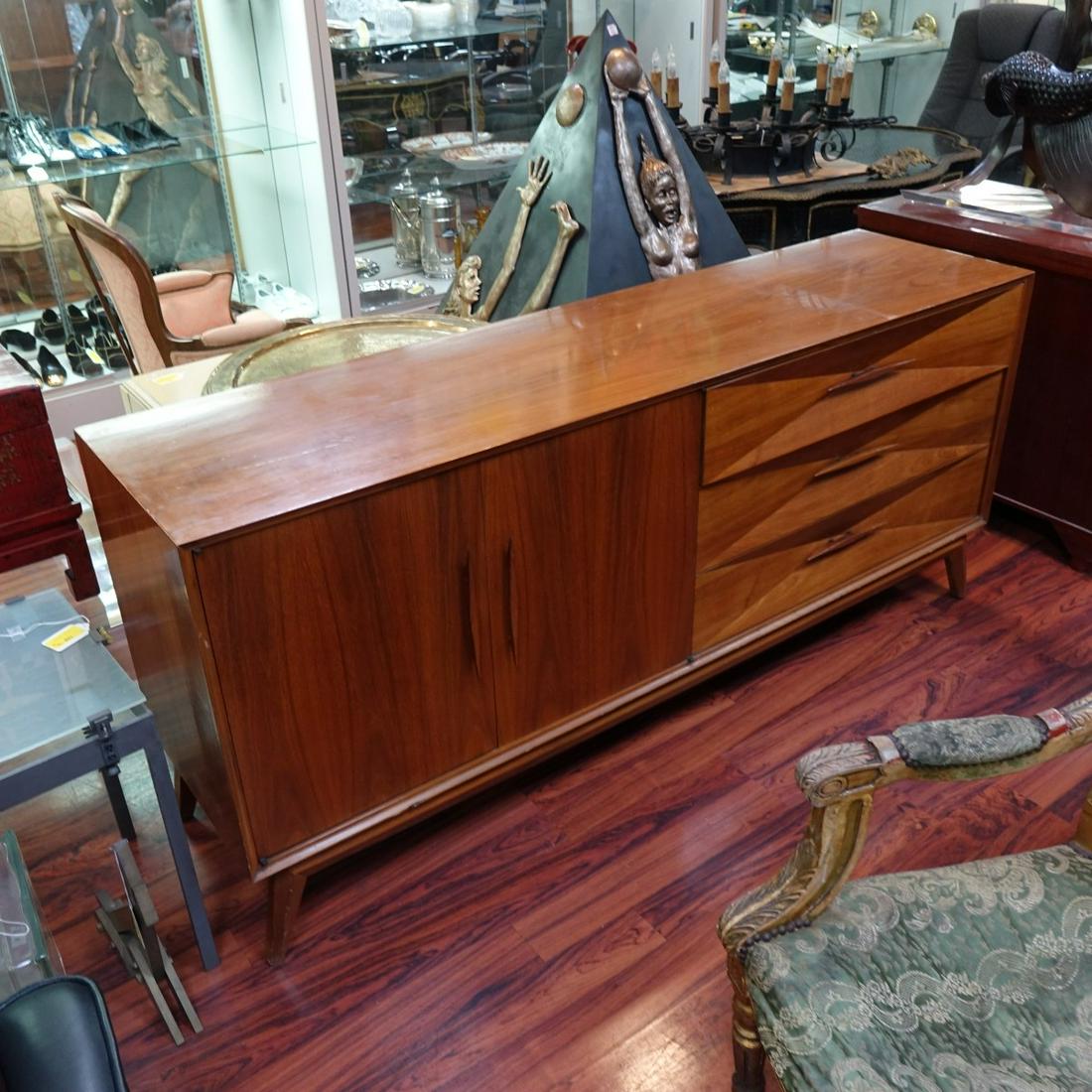 Mid 20th Century Credenza: Mid 20th Century Modern Credenza. Three drawers on right side, two doors on left side with three interior open drawers. Unsigned. Measures 32-3/8" H, 73" L, 19" D. Condition: Good vintage condition. S