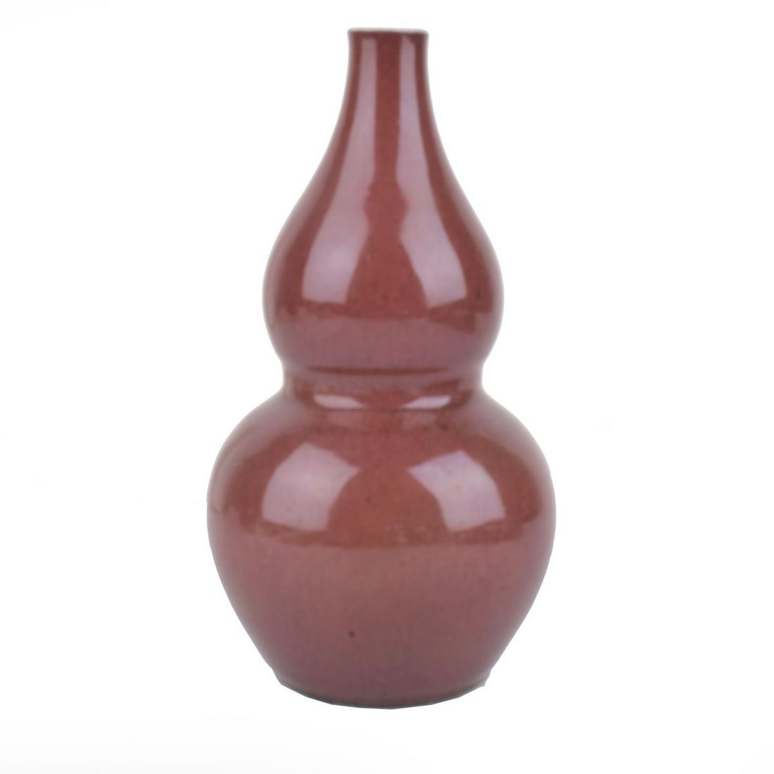 Chinese Vase: Early 20th Century Chinese Sang De Boeuf Glazed Double Gourd Porcelain Vase. Unsigned. Measures 8-1/4" x 4-1/4". Condition: Good condition. Estimate: $400.00 - $800.00 Domestic Shipping: $62.00