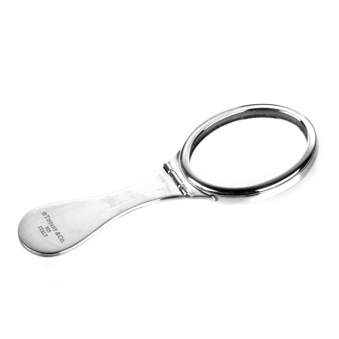 Tiffany & Co Sterling Purse Mirror: Vintage Tiffany & Co Sterling Silver Folding Purse Mirror. Signed, stamped Italy 925. Measures (open) 4" L, 1-3/8" W; 2-1/6" L (closed). Approx. weight: 36.11 grams. From the collection of The Honorab