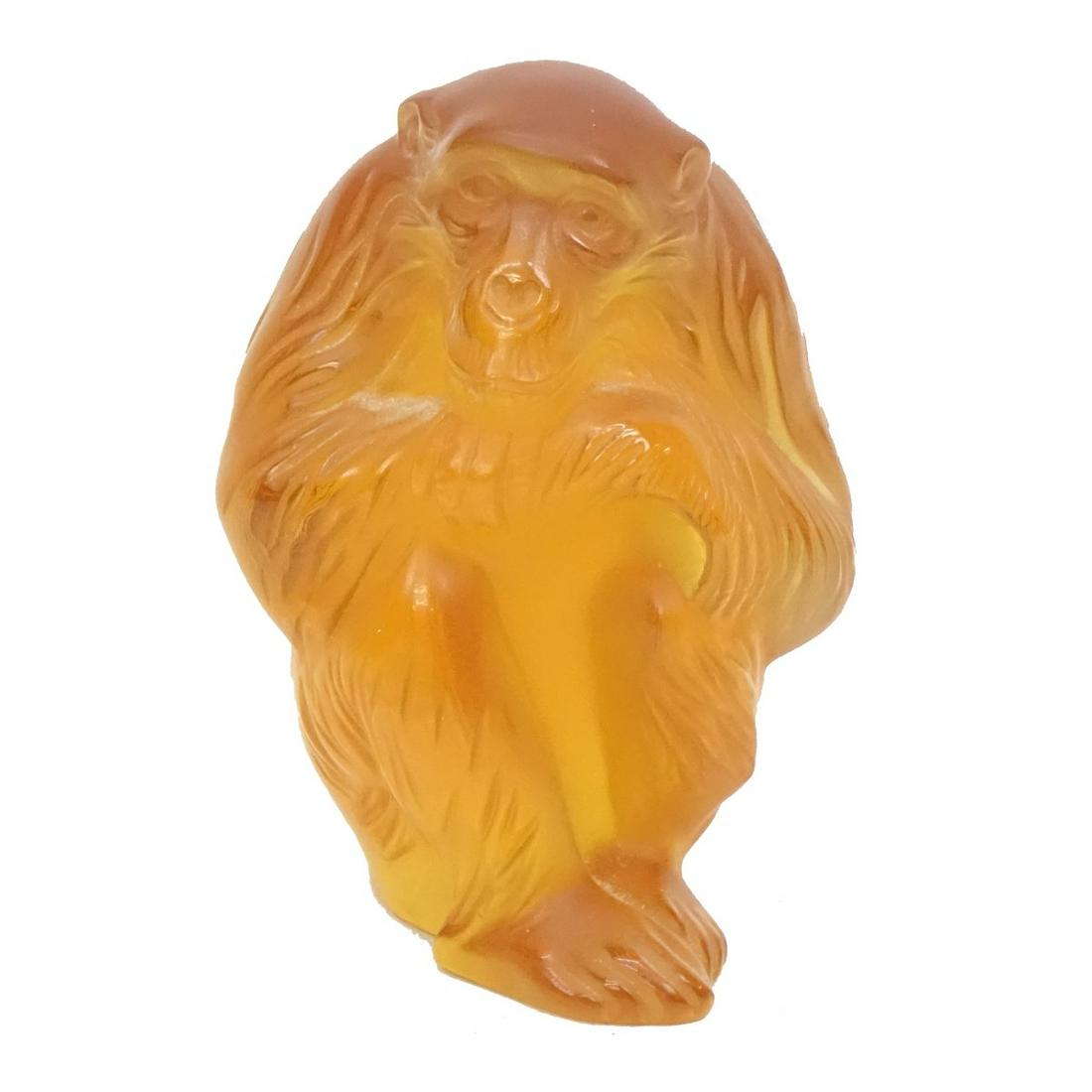 Lalique Monkey Figurine: Lalique Crystal Amber Monkey Figurine. Signed to base. Measures 5" x 3-1/4". Condition: Good condition. Estimate: $100.00 - $300.00 Domestic Shipping: $45.00