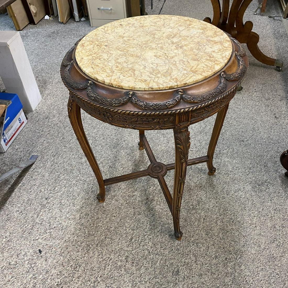 Center Table: Modern Louis XVI Style Carved Wood and Marble Top Center Table. Ribbon and acanthus leave motif. Measures 31" x 24-1/2". Condition: Normal surface scuffs otherwise good condition. Estimate: $100.00 - 