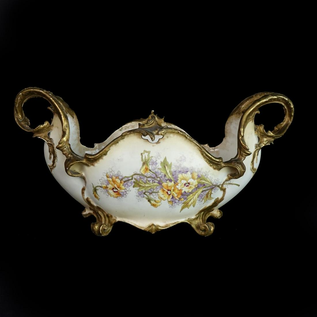 Centerpiece: Vintage Continental School Porcelain Footed Centerpiece. Unsigned. Measures 10-3/4" x 20-1/2". Condition: Rubbing, paint has been touched up otherwise good condition. Estimate: $50.00 - $150.00 Domest