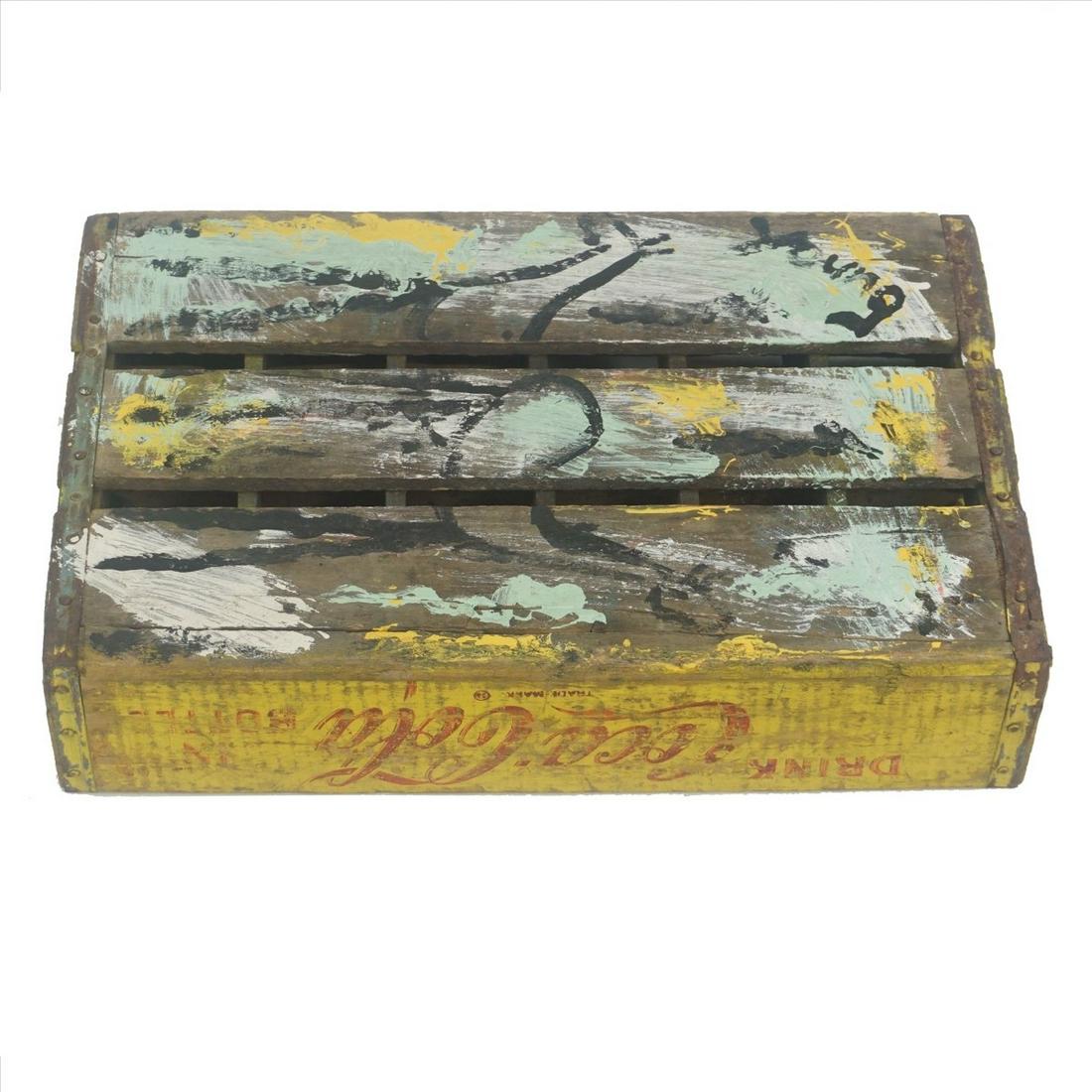 Purvis Young (1943 - 2010): Purvis Young, American (1943 - 2010) Mixed Media on Found Wood Coca Cola Basket "Two Horses" Signed Young. Measures 18-1/8" x 12" x 4-1/4". Condition: Wood in found as is condition. Estimate: $100.00 