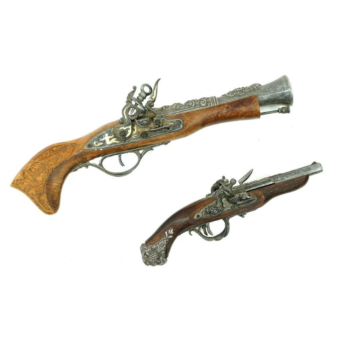 Flintlock Pistols: Grouping of Two Antique Style European Flintlock Pistols. Each having embellishments to the handles and hardware. Largest measures 17-1/8" L. Smaller measures 11-1/2" L. Condition: Larger pistol has a