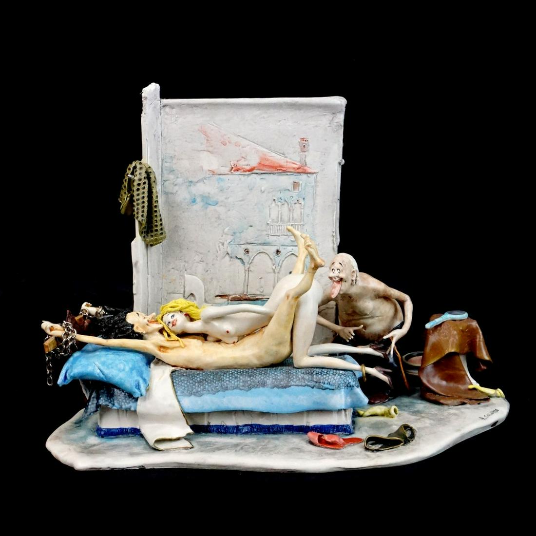 A. Colombo Ceramic Figurine: Italian Erotic Ceramic Sculpture Signed A. Colombo. Measures 9" x 11-3/4" x 7". Condition: Good condition. Estimate: $300.00 - $600.00 Domestic Shipping: Third party