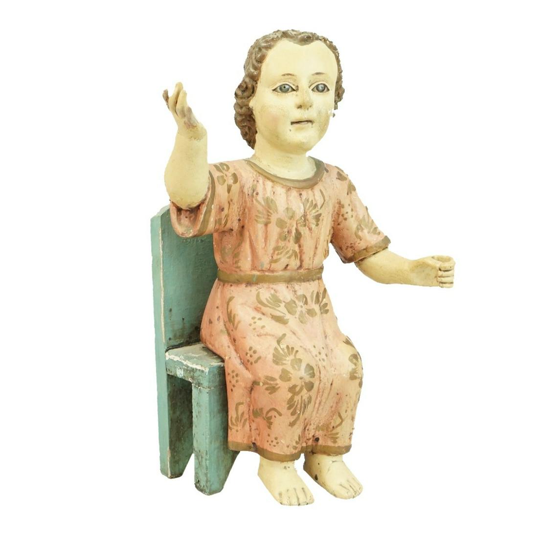 Santos Figure: Antique Spanish School Santos Figure with Associated Chair. Measures 13-1/4" x 9" x 6-1/2". Condition: Surface wear and rubbing otherwise good condition. Estimate: $50.00 - $150.00 Domestic Shipping: 